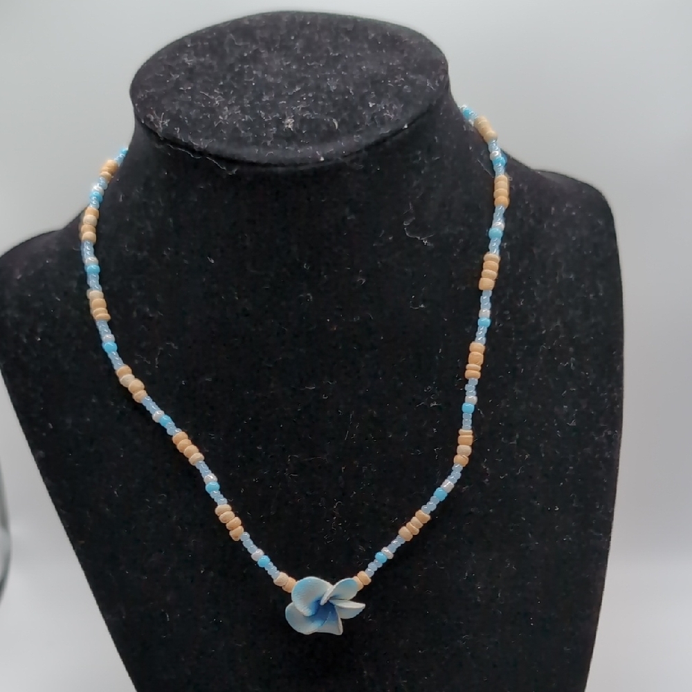 Blue and Tan Beaded Necklace with Flower Pendant